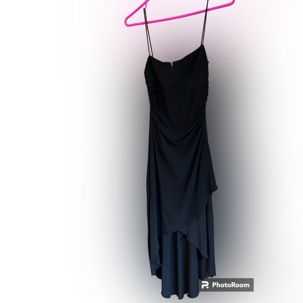 Black form fitting high low city triangles dress. Size 5. Great fit & quality
